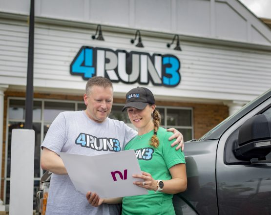 Alt text rec: Jill and Tim Murphy, 4Run3 entrepreneurs, reading New Valley Bank PPP application in front of their retail store Alt text rec: Jill and Tim Murphy, 4Run3 entrepreneurs, reading New Valley Bank PPP application in front of their retail store